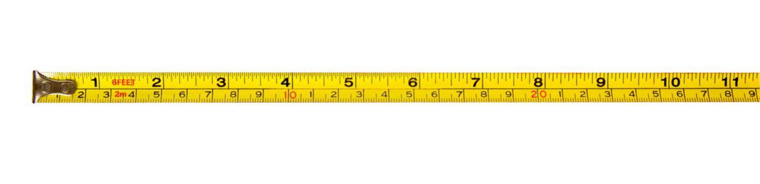Yellow measuring tape ruler isolated on a clean white background. Panoramic front view of empty metal tape measure with inch and centimeter metric scales for construction, DIY engineering,  tailoring