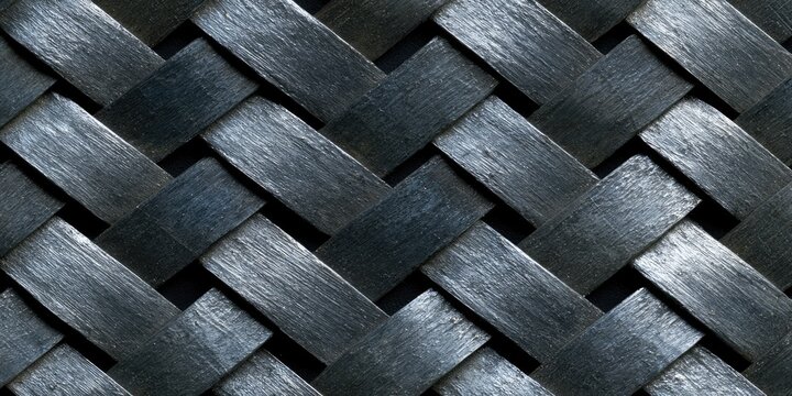 Close-up textured weave pattern of dark grey, interlocking fibers