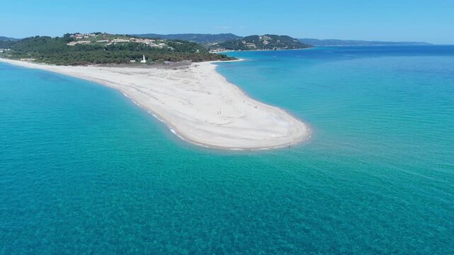 High angle aerial drone view of the spectacular Possidi Cape sandspit with its white sandy beach surrounded by crystal clear turquoise blue sea water in Halkidiki Greece