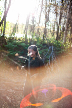 Smiling woman spending leisure time in forest
