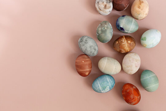 Colorful Easter eggs over beige background