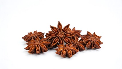 Fototapeta premium Star Anise Spice Pods, Close-Up of Dried Star Anise Seeds on White Background, Aromatic Asian Cooking Ingredient for Culinary and Medicinal Use.