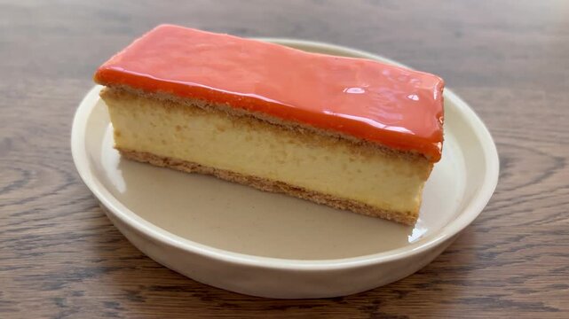 Tompouce or tompoes cake with orange icing. Traditional Dutch pastry for Koningsdag (King&rsquo;s Day) national celebration in the Netherlands.