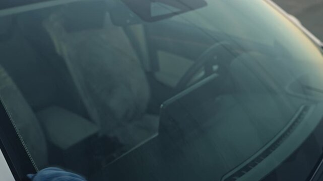White Man Final Polish Reveals Clean Windshield View, Circular Buffing With Microfiber, Glove On Hand, Subtle