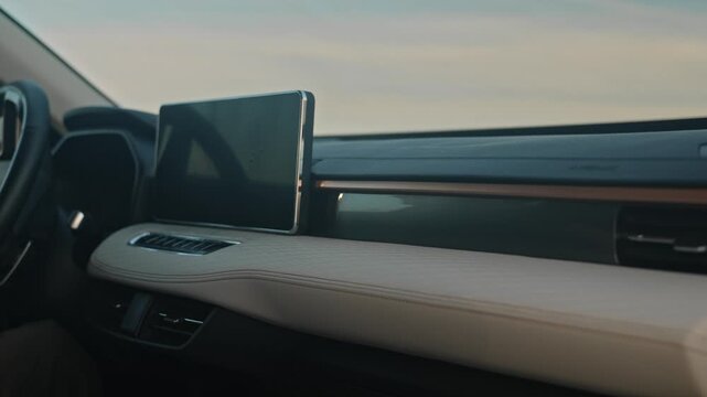 Wipe the dusty dashboard screen in your car with a soft cloth and gently remove the dust from the trim