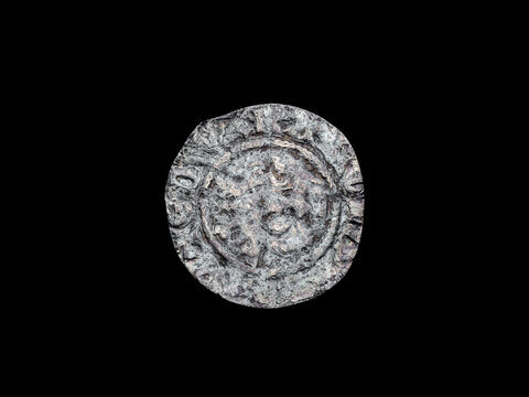 Silver long cross penny English hammered coin of King Edward II Class 10cf obverse 14th century 1305- 1310 minted in London England, cut out and isolated on a black background