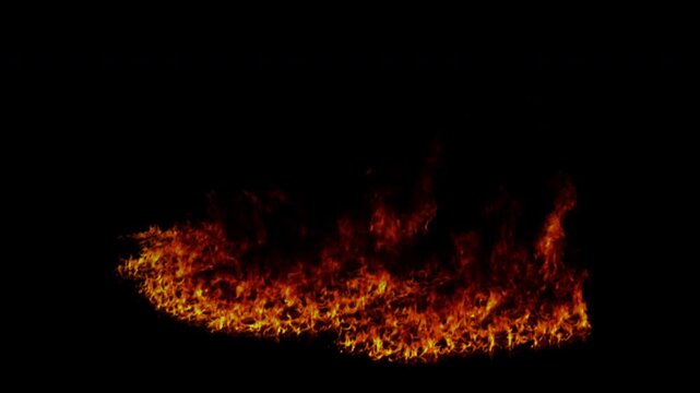 Realistic ground fire burning intensely with hot flames and sparks on a black background.