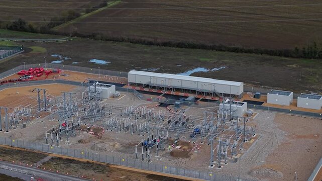 Drone view of high-voltage transformers and busbar infrastructure in Bedfordshire.