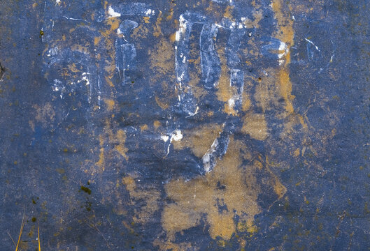 Worn yellow accented plaster. Industrial aged plaster with peeling layers and gritty appearance