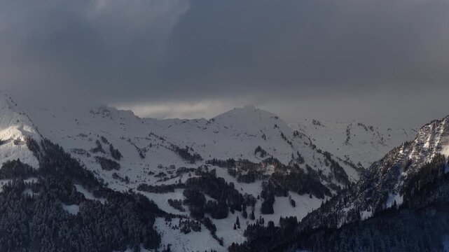 Churfirsten mountain landscape Swiss alpine region winter snow covered pine forest slope