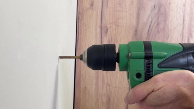 electric drill rasping and humming when drilling a cement wall