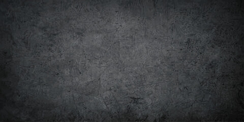 Fototapeta premium A dark, gritty, and textured concrete surface. The image showcases the rough, industrial aesthetic of weathered concrete with subtle variations in tone and shadow.