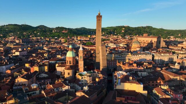 Drone shot of ancient Italian city of Bologna. Aerial view of medieval towers and rooftops in the morning