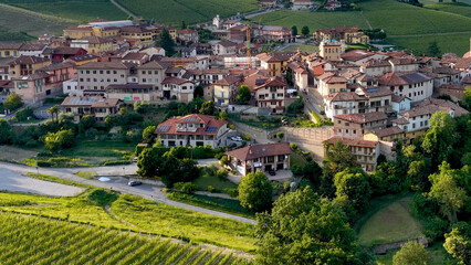 Obraz premium Aerial View of Barolo Village Surrounded by Lush Green Vineyards