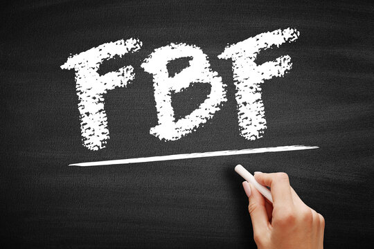 FBF text on a chalkboard, standing for Flashback Friday. Hand holding chalk near the underlined abbreviation used for sharing nostalgic memories and old photographs on social media platforms