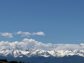 Fototapeta premium Snowy Italian Alps Mountain Range Under Clear Blue Sky in Piedmont