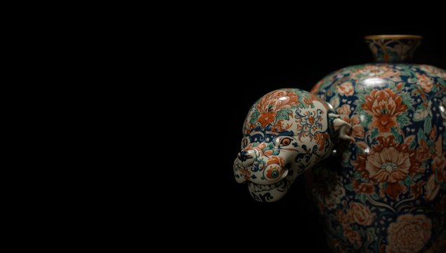 Black background image of softly focused Japanese antique imari porcelain