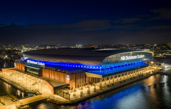 Everton Football Club stadium in Liverpool, illuminated at dusk beside the River Mersey. Hill Dickinson Stadium. 