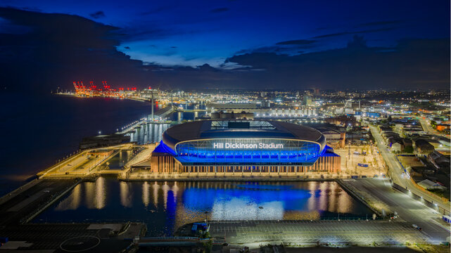 Everton Football Club stadium in Liverpool, illuminated at dusk beside the River Mersey. Hill Dickinson Stadium. 
