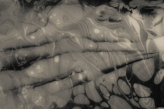 Grey monochromatic marbled paper texture, antique bookbinding endpaper background