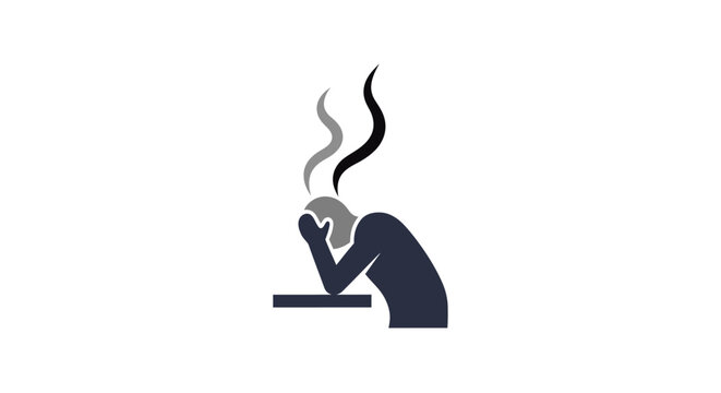 A person sitting at a desk feeling stressed.