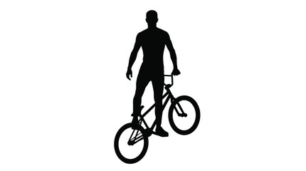 Fototapeta premium Silhouette of a young man performing a stylish trick on his bmx bicycle in this photo