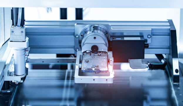Robot holding glue syringe Injection in mobile phone factory