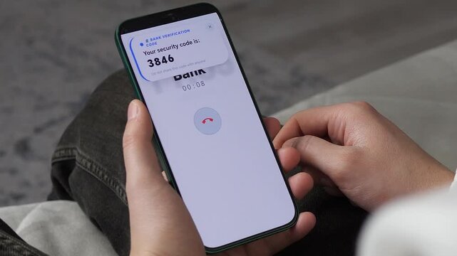 Banking security in action. Smartphone screen showing a verification code with a Do not share warning during a call. Perfect for cybersecurity, fraud prevention, and digital privacy content. High