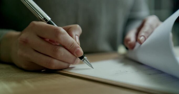 Woman is signing the documents