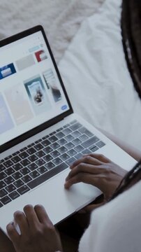 Woman Working on Laptop Keyboard in Cozy Workspace