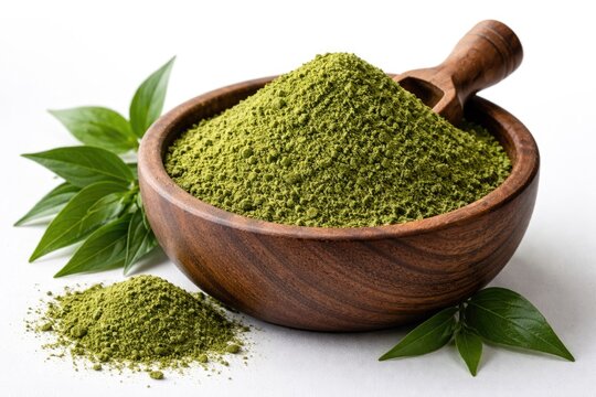 Powdered Kariyat leaf shown in a wooden container against white backdrop