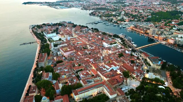 Aerial view of Zadar old town peninsula at twilight.