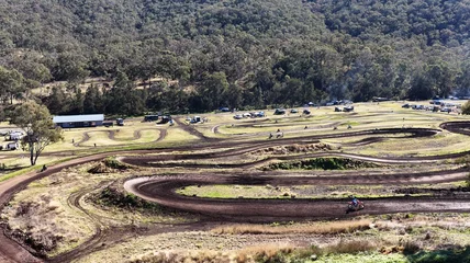 Fototapeten Extremsportarten Aerial View of a Winding Dirt Motocross Track in Rural Australia  © blueringmedia