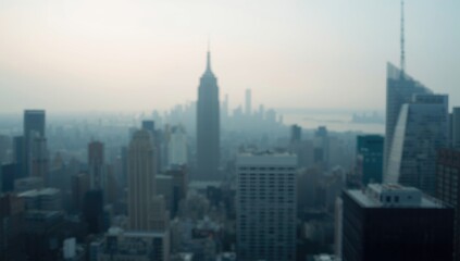 Obraz premium blurred city skyline backdrop with gentle haze over buildings