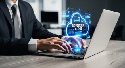 Fototapeta premium Business professional using laptop with glowing sovereign cloud computing interface and data analytics in modern office