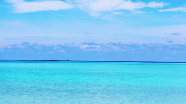 Beautiful sunny clear blue sky n deep sea horizon with white cloud or fluffy cloudscape n boat sailing on calm ocean wave in tropical summer or spring sunlight n sun ray at daylight sunshine day