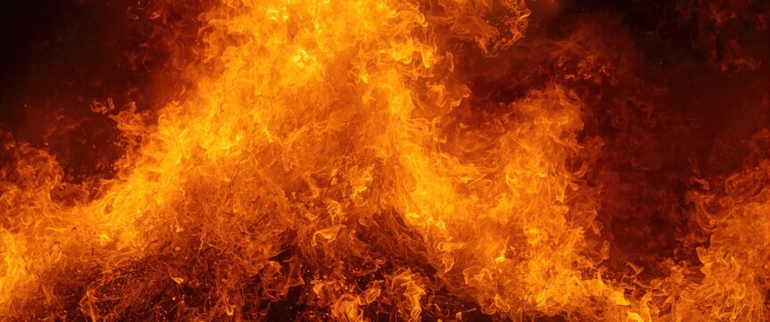 A tremendous fire blast with glowing orange and yellow flames signifying fire's consuming force