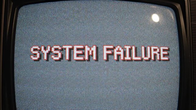 Retro analog television displays a pixelated 'SYSTEM FAILURE' message across its grainy screen, evoking nostalgia for early computing and the abrupt cessation of electronic operations