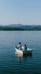 Fototapeta premium Father and son sitting in a small boat on a peaceful lake with distant hills for scenic wallpaper and travel banner design