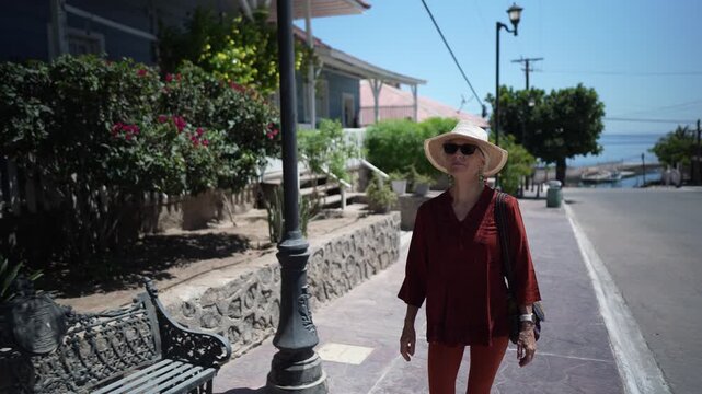 A mature woman explores Santa Rosalia in Baja California Mexico. She enjoys the sights along the streets and around the area.