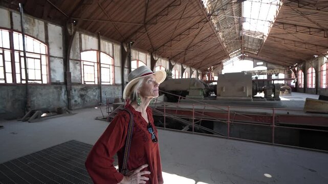 Mature woman enjoys her time visiting historical locations in Santa Rosalia Baja California Sur Mexico near the Sea of Cortez.