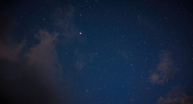 Bright night sky featuring Antares and nearby star clouds
