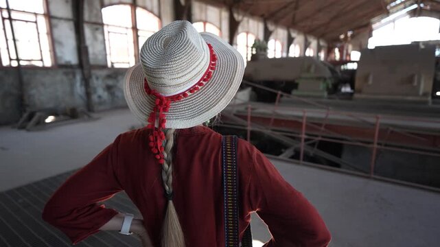 Mature woman walks through Santa Rosalia in Baja California, Mexico exploring local architecture and taking in the surroundings.