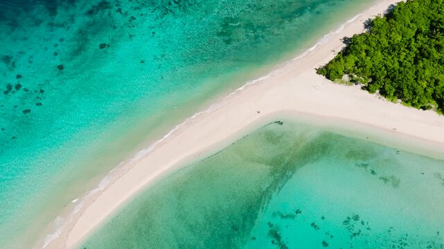 Sandbar with beautiful ocean waves. Turquoise sea water in Romblon Island. Romblon, Philippines.