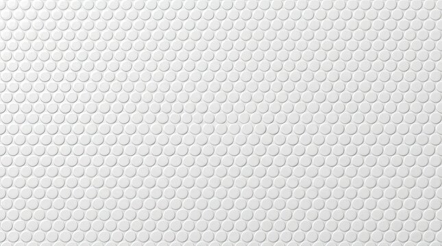 A white ceramic tile pattern displays a dense arrangement of circular indentations. The pattern covers the entire image, creating a uniform, textured surface.