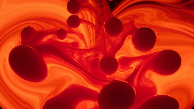 Abstract vibrant red liquid shapes swirling in smooth fluid motion with glowing organic patterns
