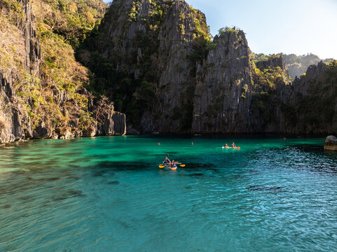 Kayaking on turquoise lagoon water in coron palawan