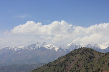 Fototapeta premium A view of snow-capped mountains in Uzbekistan in spring