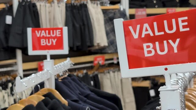 Value buy sale sign at a clothing store