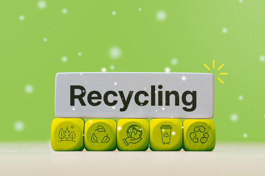 Recycling concept with green wooden cubes, eco icons and bold text on a background. Sustainable environment banner for waste management, circular economy, CSR communication and eco marketing design.
